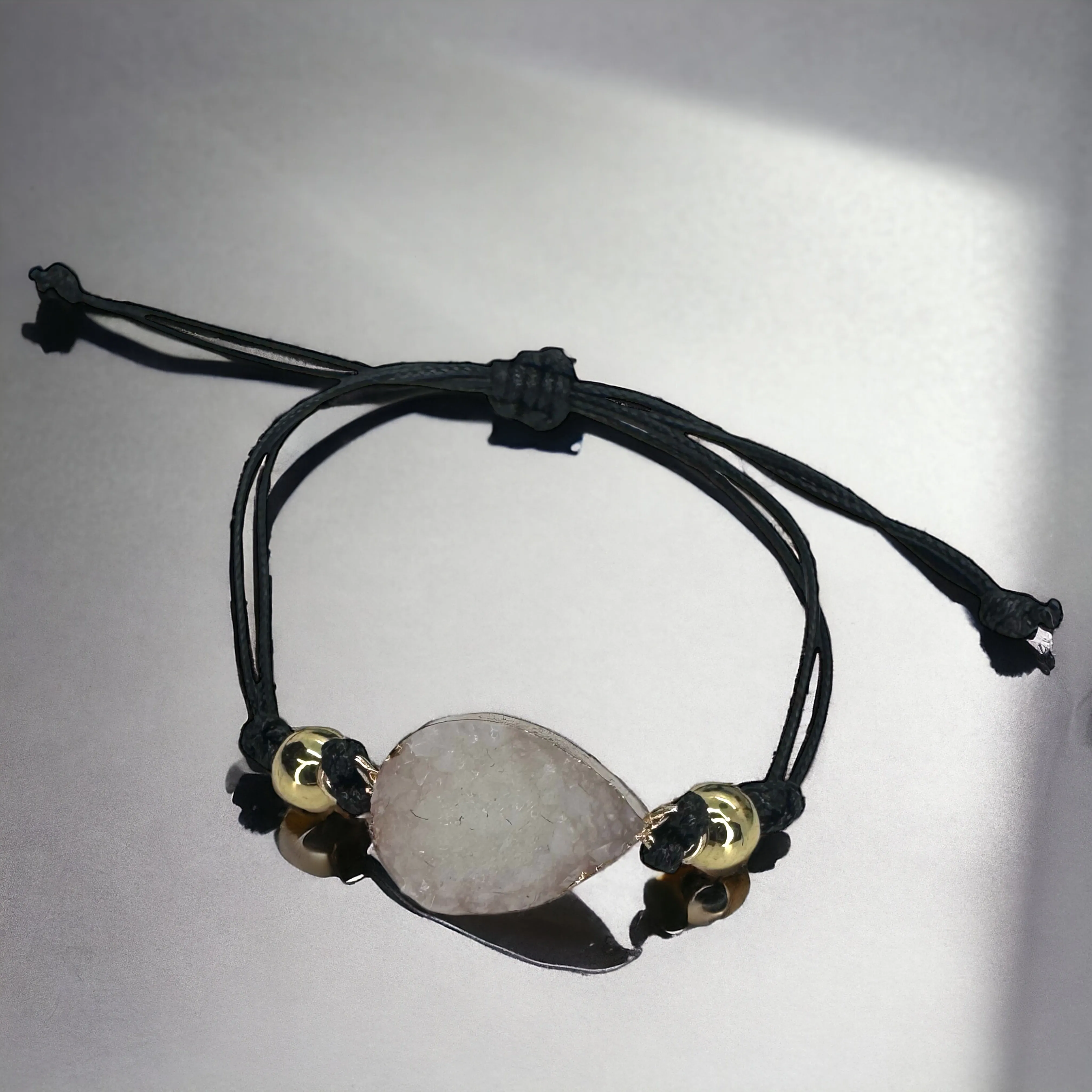 Black Leather Bracelet with Gold and White Charm