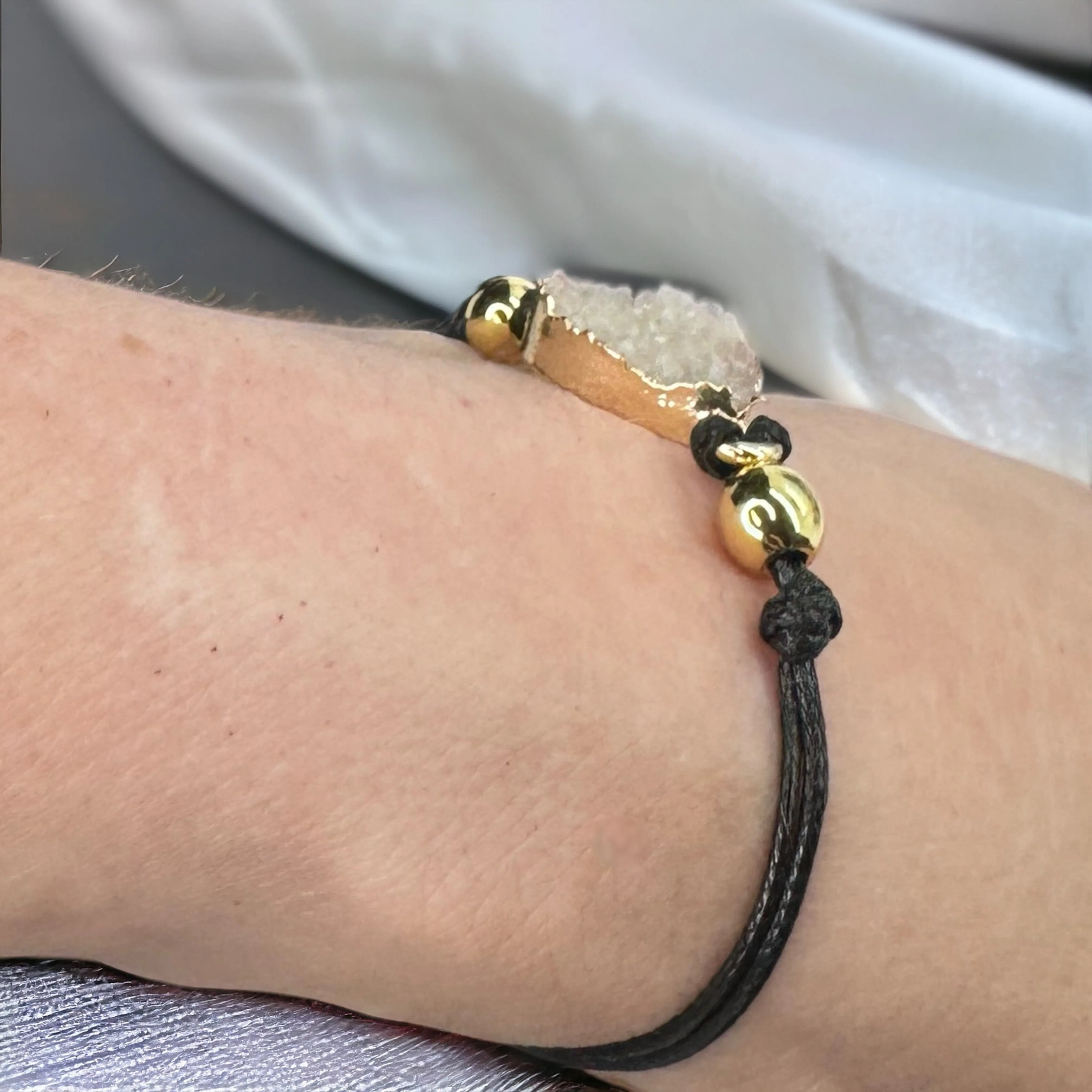 Black Leather Bracelet with Gold and White Charm