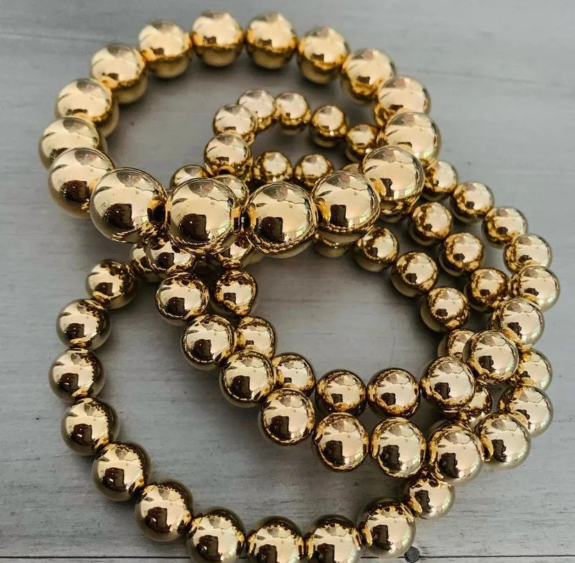 Four Gold Bead Bracelets